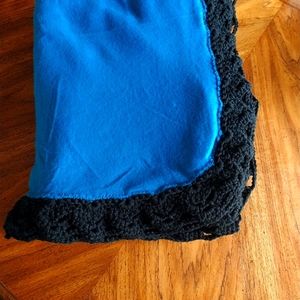 Teal fleece blanket with skull border